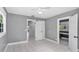 Bedroom with tile floors, natural light and multiple doors leading to other rooms at 1028 W Marjorie St, Lakeland, FL 33815