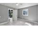 Clean bedroom with natural light, tile floors and doorway to a patio at 1028 W Marjorie St, Lakeland, FL 33815