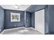 Clean and bright bedroom featuring tile floors, a window with natural light, and a closet at 1028 W Marjorie St, Lakeland, FL 33815