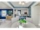 Charming dining area featuring bright white cabinets and a view into the living room at 1028 W Marjorie St, Lakeland, FL 33815