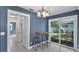 Stylish dining area with blue wainscoting and sliding glass doors to the backyard at 1028 W Marjorie St, Lakeland, FL 33815