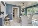 Cozy dining area with natural light and view into the living area and hall at 1028 W Marjorie St, Lakeland, FL 33815