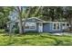 Well-maintained home with lush lawn and charming architectural details at 1028 W Marjorie St, Lakeland, FL 33815