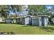 Charming single-story home with a well-maintained lawn and mature trees in a desirable neighborhood at 1028 W Marjorie St, Lakeland, FL 33815