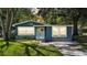 Charming single-story home with light blue siding and a well-maintained front yard at 1028 W Marjorie St, Lakeland, FL 33815