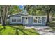Charming single-story home with light blue siding and a well-maintained front yard at 1028 W Marjorie St, Lakeland, FL 33815