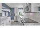 Bright kitchen features white cabinets, marble countertops and stainless steel appliances at 1028 W Marjorie St, Lakeland, FL 33815