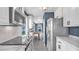 Bright kitchen features white cabinets, marble countertops and stainless steel appliances at 1028 W Marjorie St, Lakeland, FL 33815