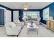 Cozy living room with neutral furniture, bright windows, and a calming ambiance at 1028 W Marjorie St, Lakeland, FL 33815