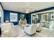 Inviting living room with blue accent walls and stylish furnishings leading to the dining area at 1028 W Marjorie St, Lakeland, FL 33815