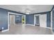 Open living space showing views of dining area, multiple entry points, and bright floor tiles at 1028 W Marjorie St, Lakeland, FL 33815