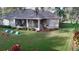 Well-kept backyard with a screened-in porch, ideal for relaxation and enjoying the outdoors at 10812 Versailles Blvd. Blvd, Clermont, FL 34711
