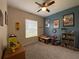 Bedroom with a ceiling fan, carpeted floors, and colorful decor, perfect for a space at 10812 Versailles Blvd. Blvd, Clermont, FL 34711