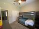 Bedroom with carpeted floors and a bunk bed and access to an adjacent room at 10812 Versailles Blvd. Blvd, Clermont, FL 34711