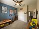 Bedroom with carpeted floors, colorful walls, decor, and a closet providing ample storage at 10812 Versailles Blvd. Blvd, Clermont, FL 34711