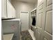 Functional laundry area with washer, dryer, cabinets, and a built in organizer at 10812 Versailles Blvd. Blvd, Clermont, FL 34711