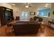 Open living room with hardwood floors and comfortable seating. Doors lead to back porch at 10812 Versailles Blvd. Blvd, Clermont, FL 34711