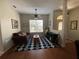 Inviting living room with a large window, comfortable sofa, and stylish decor at 10812 Versailles Blvd. Blvd, Clermont, FL 34711