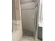 The main bathroom features a tiled shower with a glass door and tiled floors at 10812 Versailles Blvd. Blvd, Clermont, FL 34711
