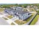 An aerial shot of modern townhomes featuring a spacious layout and well-maintained green spaces in a quiet community at 1180 Windjammer Dr, Lakeland, FL 33803