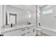 Bathroom featuring double sinks with marble countertop and a bathtub at 1180 Windjammer Dr, Lakeland, FL 33803