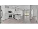 Modern kitchen with white cabinetry, stainless steel appliances, subway tile backsplash, and hardwood floors at 1180 Windjammer Dr, Lakeland, FL 33803