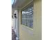 Home exterior showing glass block window and brick walkway at 11953 Delfina Ln, Orlando, FL 32827