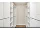 Spacious walk-in closet with ample shelving and storage space, offering organization and convenience at 11953 Delfina Ln, Orlando, FL 32827