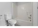 Clean bathroom with a standard bathtub and toilet, providing essential functionality and comfort at 120 Flatfish Ct, Kissimmee, FL 34759