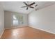 Neutral bedroom with a ceiling fan and a large window offering plenty of natural light at 120 Flatfish Ct, Kissimmee, FL 34759