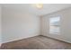 Cozy bedroom featuring neutral carpet, a window, and ample natural light at 120 Flatfish Ct, Kissimmee, FL 34759