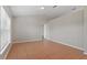 Sunlit room with neutral walls, tile floors and a view of the outdoor landscape at 120 Flatfish Ct, Kissimmee, FL 34759