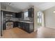 Well-lit kitchen featuring stainless steel appliances, dark cabinets, and tile backsplash at 120 Flatfish Ct, Kissimmee, FL 34759