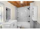 Bathroom features marble tiled shower, built-in shelving, and a modern vanity with a sink at 126 Mason St, Auburndale, FL 33823