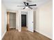 This bedroom features a ceiling fan, wood-look floors, and a closet at 126 Mason St, Auburndale, FL 33823