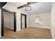 Living room with black doorframes, neutral colored walls, and wood laminate flooring at 126 Mason St, Auburndale, FL 33823