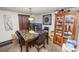 Dining room showcases a marble-top table, seating for four, and a wooden hutch with display shelving at 1306 N Webster Ave, Lakeland, FL 33805