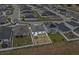 Aerial view shows the home's location, close to the street, with a spacious fenced backyard at 1341 Mattie Pointe Blvd, Auburndale, FL 33823