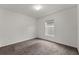 Cozy bedroom featuring neutral walls, carpet, and a window at 1341 Mattie Pointe Blvd, Auburndale, FL 33823