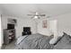 Bright bedroom with a ceiling fan, gray bedding, and decor at 1341 Mattie Pointe Blvd, Auburndale, FL 33823