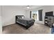 Bedroom with a black bed frame, a large window, and neutral decor at 1341 Mattie Pointe Blvd, Auburndale, FL 33823