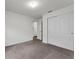 Bedroom with neutral walls, carpeted floors, and a closet at 1341 Mattie Pointe Blvd, Auburndale, FL 33823