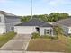 Beautiful home with a well-kept lawn, tidy landscaping, and an attached two-car garage at 1341 Mattie Pointe Blvd, Auburndale, FL 33823