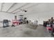 Spacious garage interior featuring ample storage space for tools and recreational items at 1341 Mattie Pointe Blvd, Auburndale, FL 33823