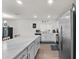 Bright kitchen with stainless steel appliances, a peninsula and a breakfast bar at 1341 Mattie Pointe Blvd, Auburndale, FL 33823