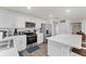 Modern kitchen featuring sleek stainless steel appliances, an island with marble countertop, and ample cabinetry at 1341 Mattie Pointe Blvd, Auburndale, FL 33823