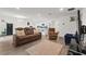 Spacious living room with open floor plan to the kitchen, creating an inviting atmosphere at 1341 Mattie Pointe Blvd, Auburndale, FL 33823