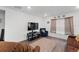 Cozy living room with light gray walls, wood-look floors, and a comfortable seating arrangement at 1341 Mattie Pointe Blvd, Auburndale, FL 33823
