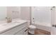 Bathroom with large white vanity, solid surface counter, tub and shower combination, and modern fixtures at 13650 Sw 43Rd Cir, Ocala, FL 34473
