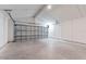 Spacious garage with high ceilings, concrete floors, and an automatic door provides secure parking at 13650 Sw 43Rd Cir, Ocala, FL 34473